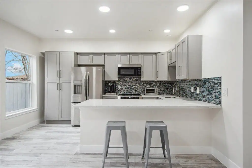 Modern kitchen with island and gray cabinetry