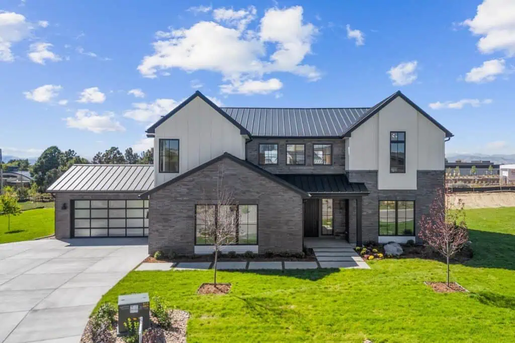 Modern two-story house with a spacious front yard.