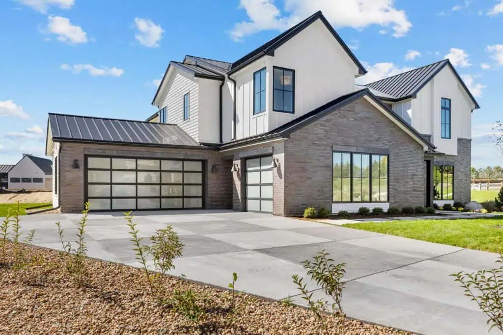 Modern suburban house with glass garage doors