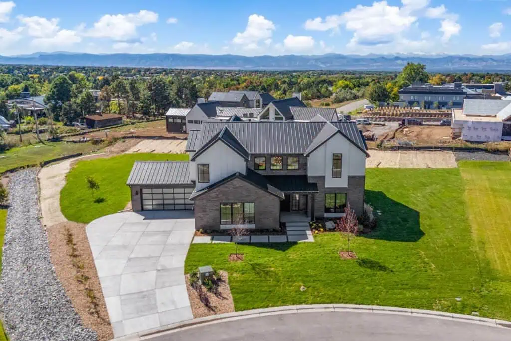Modern home with expansive yard and mountain view.