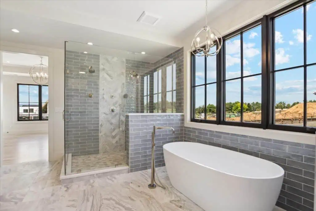 Modern bathroom with bathtub and glass shower