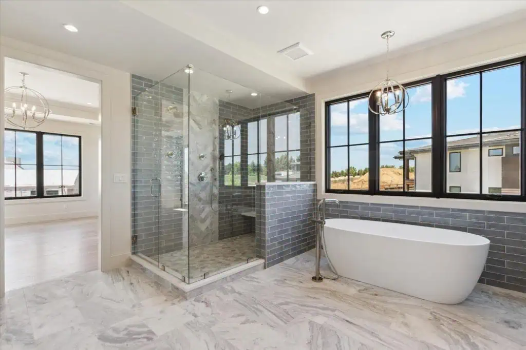 Modern bathroom with glass shower and freestanding tub