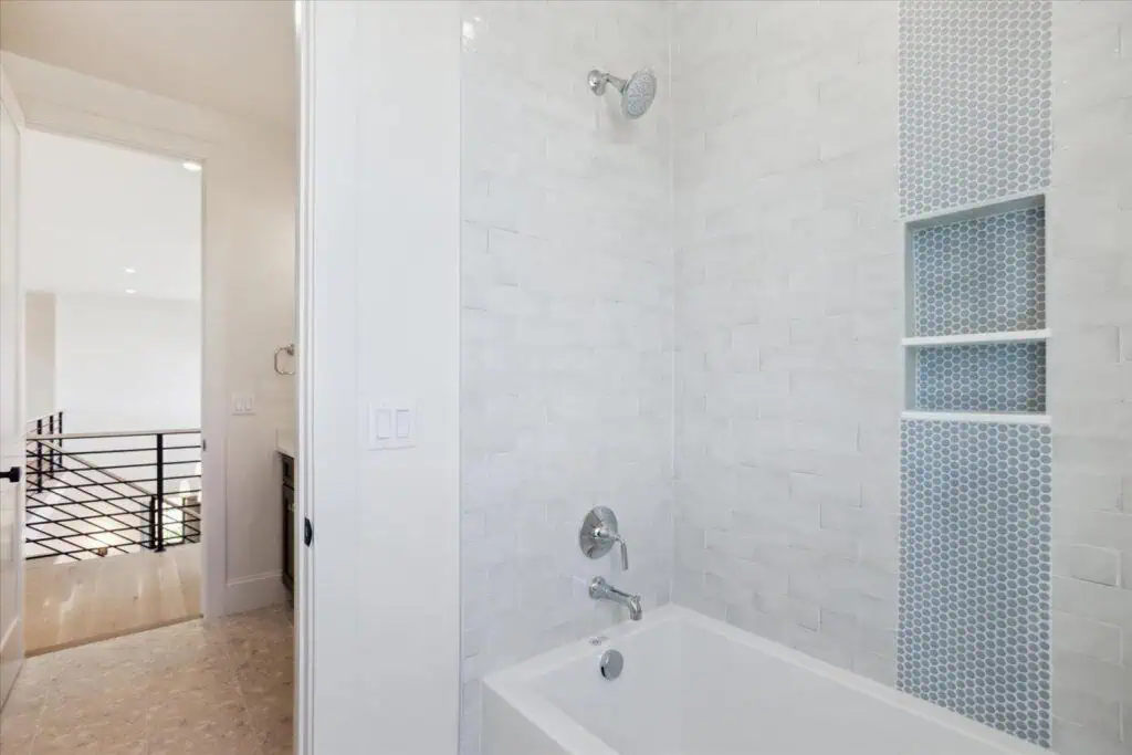 Modern bathroom with tiled shower and tub