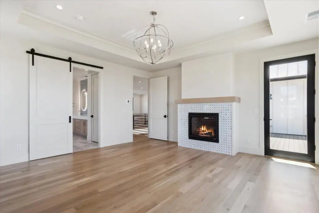 Modern living room with fireplace and sliding door.