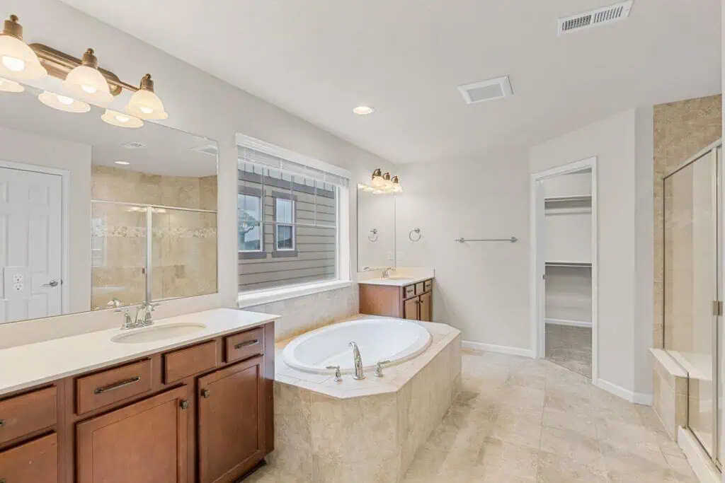 Spacious bathroom with tub and shower
