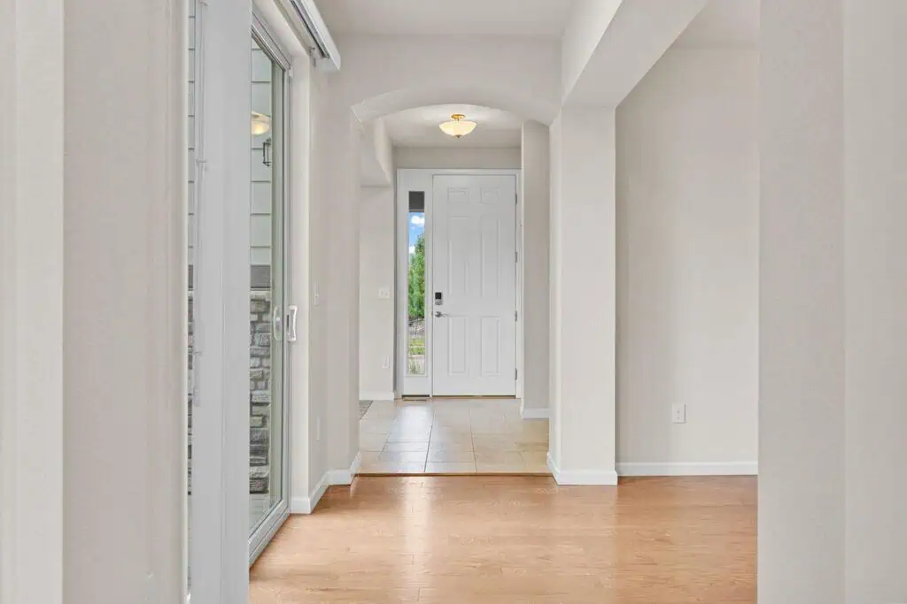 Modern home entrance with wooden floor